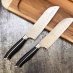 7-inch wide-blade stainless knife with black stainless–Bakelite handle